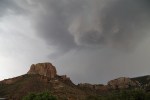 An evening storm forms over Casa Grande in the Chisos Mountains of Big Bend National Park, Texas